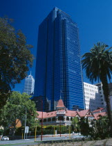 Skyscrapers looming over traditional buildings in Barrack Street