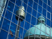 Reflection of the dome of the Queen Victoria building and the AMP / Sydney Tower seen in glass building