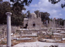 Twelth century Byzantine church.  Part restored exterior in area of fallen masonry and ruined remains of standing columns.