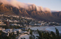 Camps Bay. View from Lions Head along the coastline and the Twelve Apostles mountain cliffs covered in a blanket of cloud