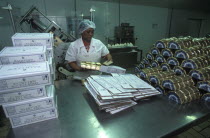 Female worker packing goats cheese at Fairview goats cheese and wine estate