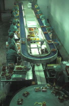 Female production line workers grading and packing strawberries at Mooiberg fruit and vegetable farm