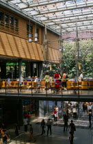Potsdamer Platz. Cafe on mezzanine floor in Daimler City with shoppers below