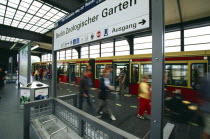 Interior of the Zoologischer Garten Railway station with a train at the platform