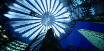 Potsdamer Platz. View looking up from the interior of the glass roof of the Sony Centre illuminated at night