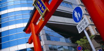 Detail of red Torii Gate in the city centre