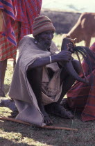 Gourds filled with honey beer are drunk at the beginning of the an initiation ceremony that will bring the young Maasai Moran or young warriors into manhood.