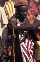 Many of the Maasai men get so drunk on Gourds filled with honey beer that they can barely stand and are drunk at the beginning of an initiation ceremony that will bring the young Maasai Moran or young...