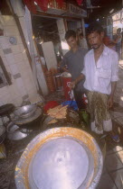 Street side shop preparing sweet  snacks for Iftar. The sunset breaking off the fast in the Islamic Ramadan.