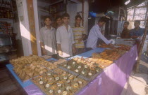 Street side shop selling snacks for Iftar. The sunset breaking off the fast in the Islamic Ramadan.