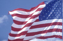 Close up of the stars and stripes flag against a blue sky