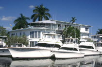 Yachts moored outside waterfront houses on Fort Lauderdales waterways