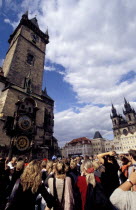 Astronomical Clock on the wall of the Town Hall with Tyn Church beyond