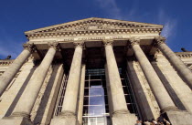 Angled view looking up at the Reichstag columned facade