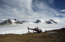 Landed helicopter on rocky ground near Juneau icefield