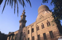 Akhur Mosque.  Exterior with carved dome and three tiered minaret.