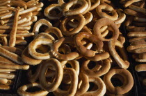 Trays piled with bread sticks and rings.