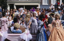 Gay Pride canal parade with men dressed in historical womens cotumes