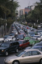 Traffic congestion on Paseo de La Reforma  long tailback of cars and taxis.  Traffic jam gridlock
