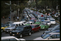 Traffic congestion on Paseo de La Reforma  long tailback of cars and taxis.  traffic jam gridlock