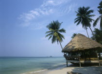 Kai Bae Beach with thatched hut restaurant at the waters edge.