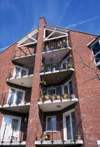 Balconies of newly built apartments erected on brown field site of former engineering works next to River Lagan