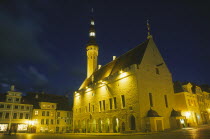 Raekoja Plats.  Exterior of the town hall illuminated at night.