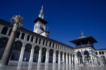 The Umayyad Mosque.  Lantern holder with ablutions fountain  Minaret of the Bride and arcade.