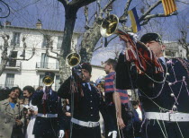 Gendarmes playing trumpets in a square in Vence during  the Easter procession of The Battle of The Flowers