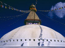Bodhnath stupa hung with prayer flags.
