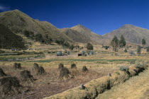 View from the train on the altiplano.  Agricultural land in the foreground  mountains beyond.