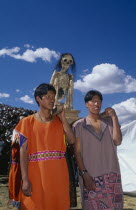 Young men carrying an ancestor mummy during Inti Raymi.   Cuzco