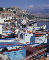 Mytilini with a view over fishing boats in the foreground across the harbour towards the town
