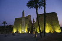 The Temple Pylons with Obelisk and statues of Ramesses II illuminated at night