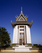 Choeung Ek Killing Fields.  Memorial Stupa erected in  1988 and containing over eight thousand skulls of victims of the Khmer Rouge.
