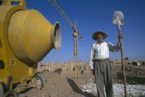Construction worker on site Spade in hand
