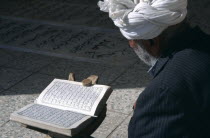 Man reading Koran