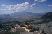 Ishak Pasha Palace. View over hillside palace toward valley and mountains in the distance