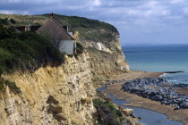 Environment, Erosion, House on the edge of an eroded cliff at Fairlight in Sussex caused by severe coastal erosion 