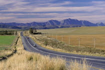 Wine area along the National road between Swellendam and Sonder End  mountains and dramatic sky in background