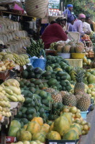 Zulu women at street stall selling fruit and hand woven baskets made from fronds of Lala palm  Hyphaene Coriacea