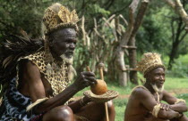 Old Zulu man in leopard skin and friend  strategist in Shakas campaigns.