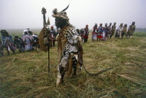 Local man in leopard skin officiating at Sangoma graduation ceremony.