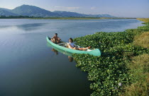 Couple fishing for bream in a canoe on the Zambezi River
