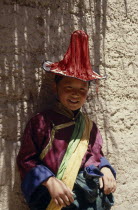 Young Tibetan boy dressed in festival dancing costume