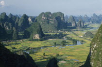 View from Moonhill with Karst limestone formations around the river valley with rice paddies