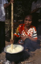 Karen refugee woman in Mae Lui village preparing Soya in a pot