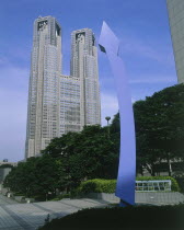 The Tokyo Metopolitan Goverment buildding in Shinjuku with a blue modern sculpture in the foreground