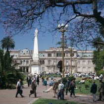 Plaza de Mayo  Piramide de Mayo  Casa Rosada  people  Jacaranda tree