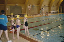 Children at indoor pool with swim instructor